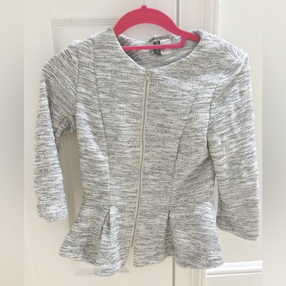 Grey/white jacket.